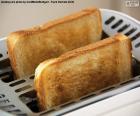 Two slices of bread and toast in the toaster