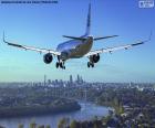 Large airliner arriving at their destination, a great city