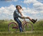 A couple in love during a bike through the countryside ride