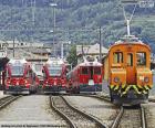 Several train parked at a station