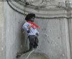 The Manneken Pis statue is a bronze statue of 65.5 cm located in the historic centre of Brussels, Belgium. It depicts a naked little boy urinating