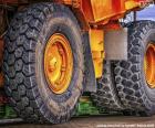 Beautiful image of the huge wheels of a large dump truck