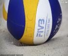 A beach volley ball. A variant of volleyball played on sand