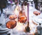 Several glasses of rosé wine on the table