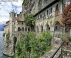 Hermitage of Santa Caterina del Sasso is a Roman Catholic monastery located in the municipality of Leggiuno, in the Province of Varese and the region of Lombardy, Italy. It is perched on a rocky ridge on the eastern shore of Lake Maggiore