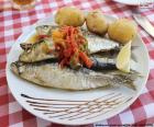 A delicious dish of roasted sardines with potatoes