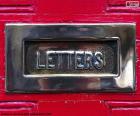 Mailbox on a red door