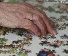 An older person solving a puzzle