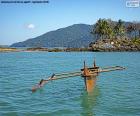 Wooden canoe in the ocean off the coast of Africa