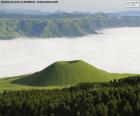 Komezuka is a volcanic cone in Aso, Japan. It is about 50 meters high, a field of green grass covers the surrounding area and its surface. It is quite a spectacle ...