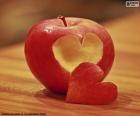 A red apple with a heart-shaped bite, love bites