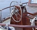 The wheel of the rudder of a sailboat