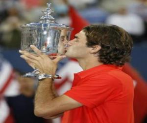 Roger Federer whit a trophy puzzle