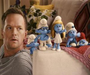 Some of the Smurfs by the man who helps them get back puzzle