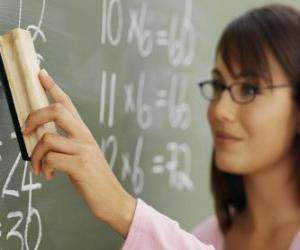 Teacher explaining the lesson on the blackboard puzzle