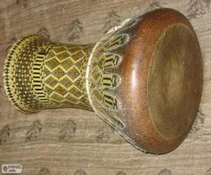 The goblet drum, also chalice drum, darbuka, debuka, Kratom, doumbek, dumbec, or tablah puzzle