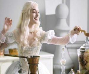 The White Queen (Anne Hathaway) working on a potion puzzle