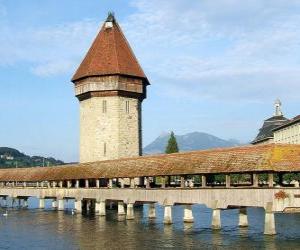 The wooden and covered bridge Kapellbrücke (the Chapel Bridge) and the tower Wasserturm in Lucerne, Switzerland puzzle