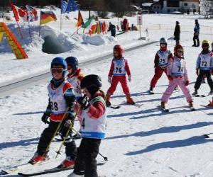 Typical winter scene with children skiing in the mountain puzzle