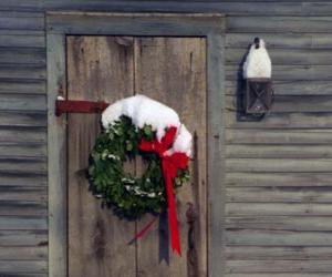 Wreath of Christmas hung in the doorway of a house puzzle